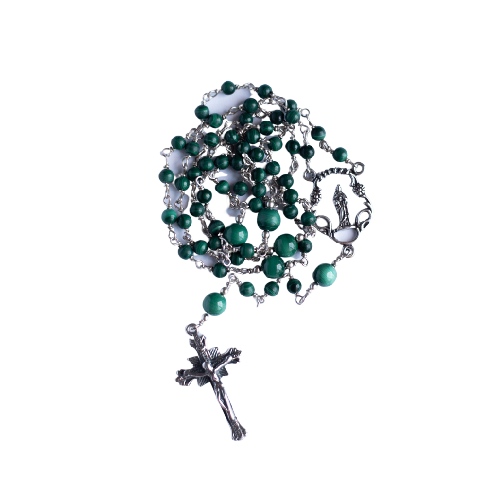 The photo shows a coiled rosary made of 4mm and 6mm Malachite (opaque green stone) beads with a religious rosary connector and modest sterling crucifix. The chain is handmade using 24-gauge half hard sterling wire.